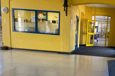 A hall with the adjoining janitor's office.