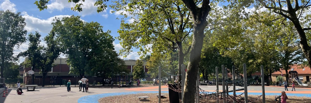 Schoolyard School playground with a climbing net.