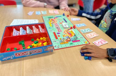 Children playing Monopoly.