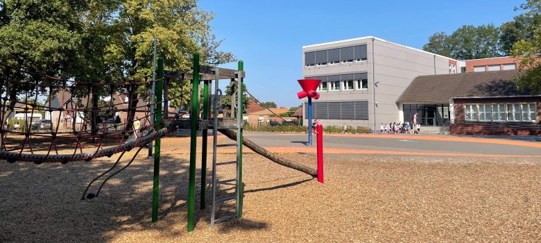 The school playground with another climbing frame and a ball pit.