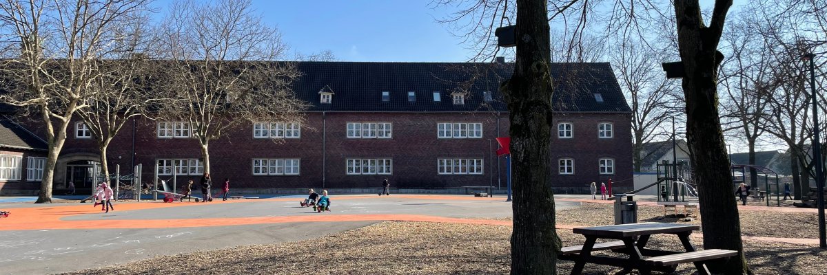 The spacious schoolyard.