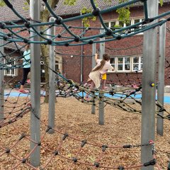 Sports festival - children climb along a climbing course